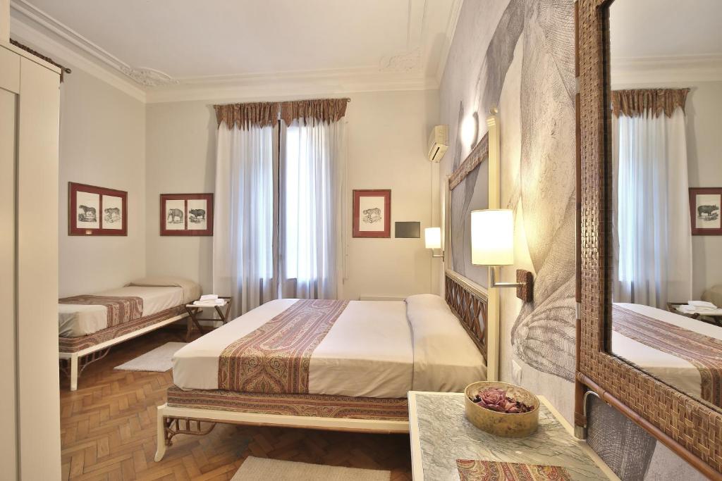 Posteľ alebo postele v izbe v ubytovaní MADAMA GUEST HOUSE