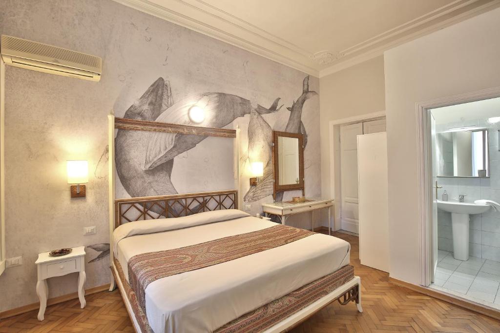 Posteľ alebo postele v izbe v ubytovaní MADAMA GUEST HOUSE