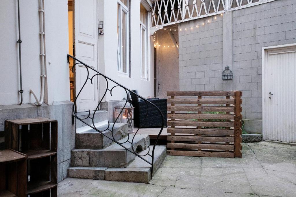 a set of stairs leading up to a building at L'hôtel de Police - Topdestination-Spa in Spa