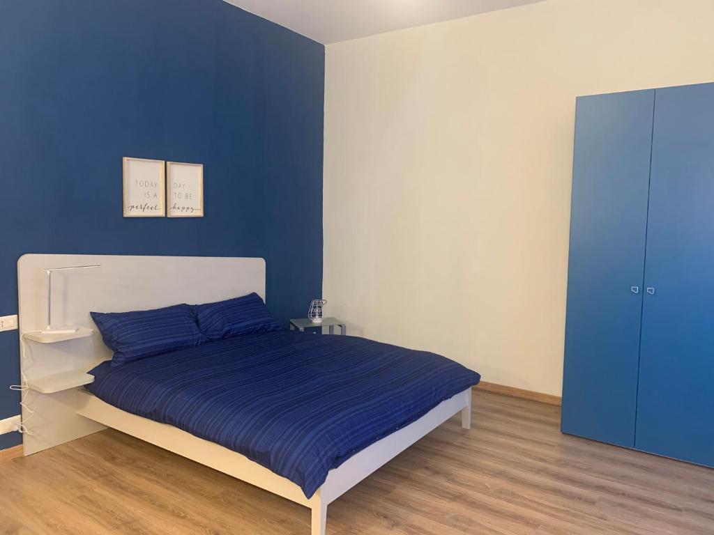 Łóżko lub łóżka w pokoju w obiekcie Iris 128: il terrazzino sul giardino