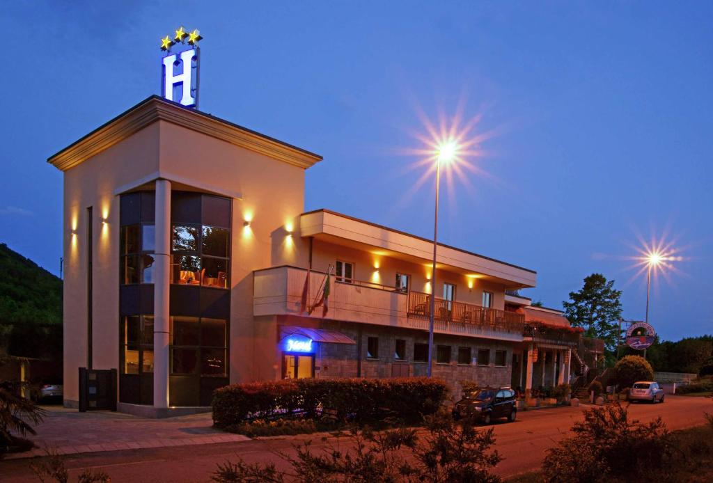 a building with a clock tower on top of it at Caprice in Avigliana