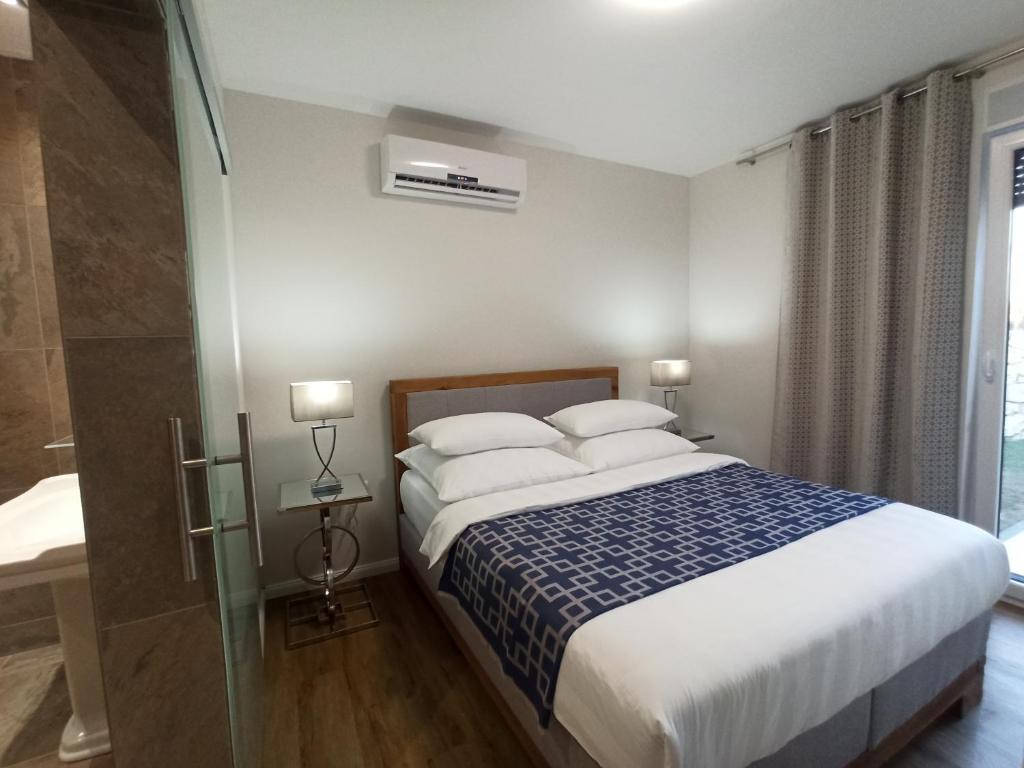 Posteľ alebo postele v izbe v ubytovaní AdriaApart Vip