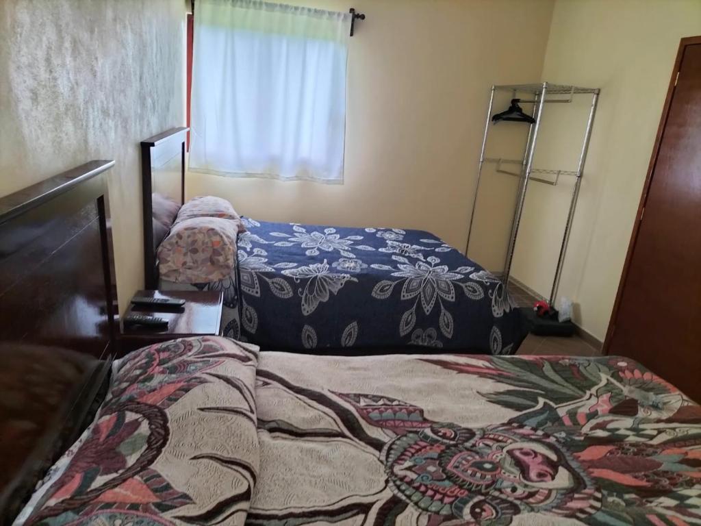 Postel nebo postele na pokoji v ubytování VILLAZOL CABAÑAS