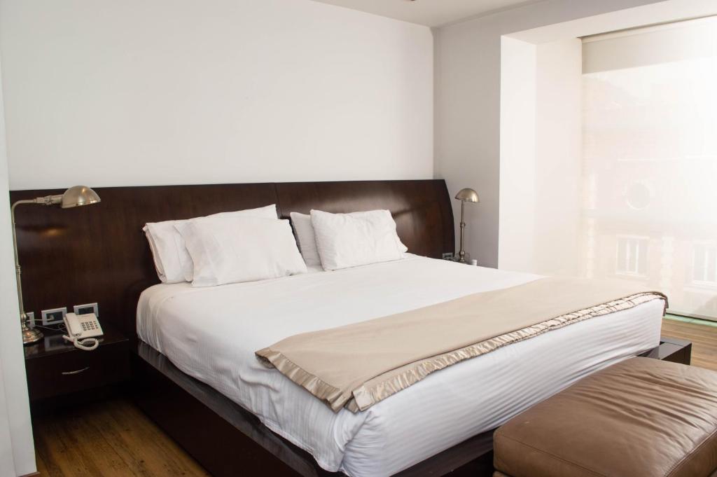 Postel nebo postele na pokoji v ubytování Suites Casa 95