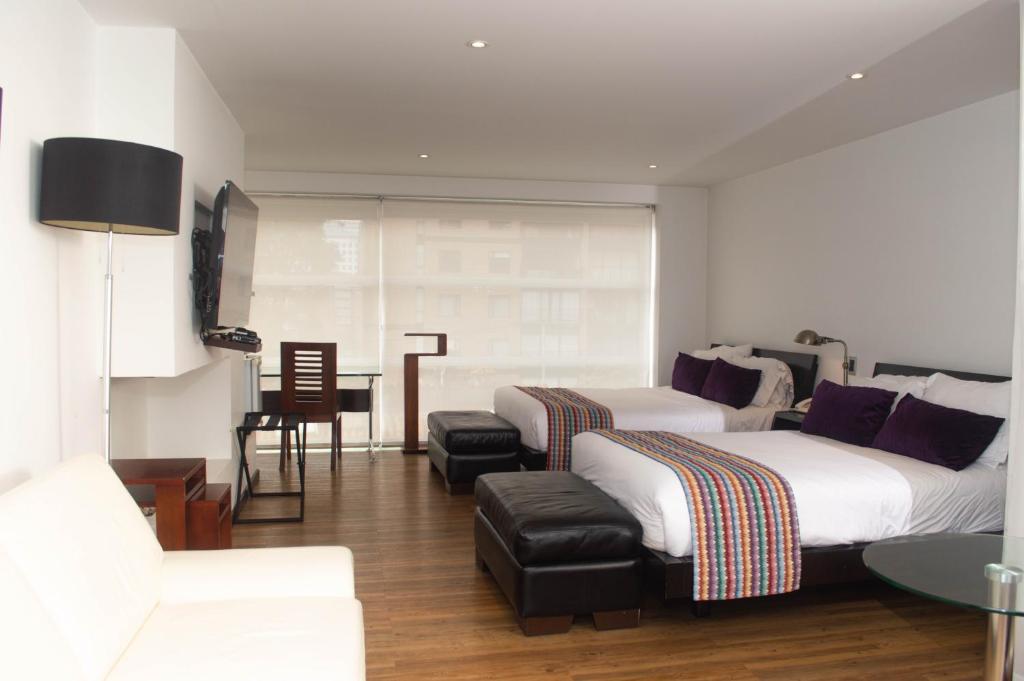 Postel nebo postele na pokoji v ubytování Suites Casa 95