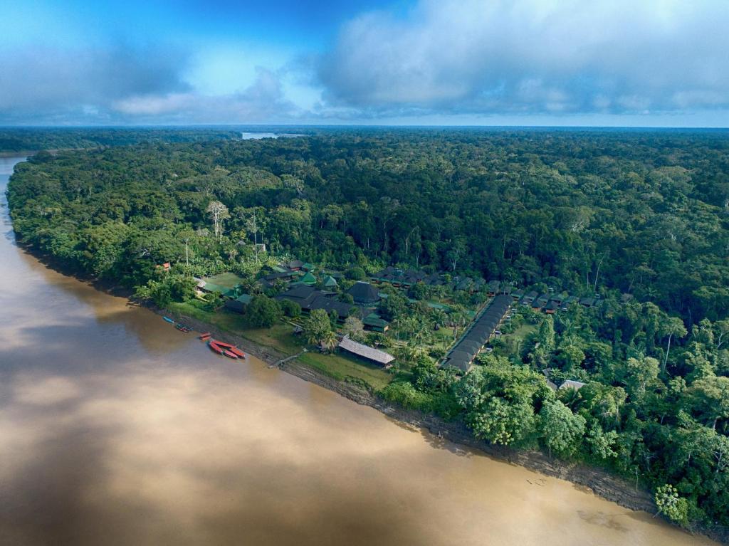 an aerial view of a river with trees at Ecoamazonia Lodge in Puerto Maldonado