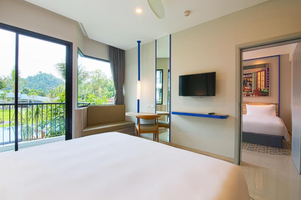Cama ou camas em um quarto em Holiday Style Ao Nang Beach Resort, Krabi