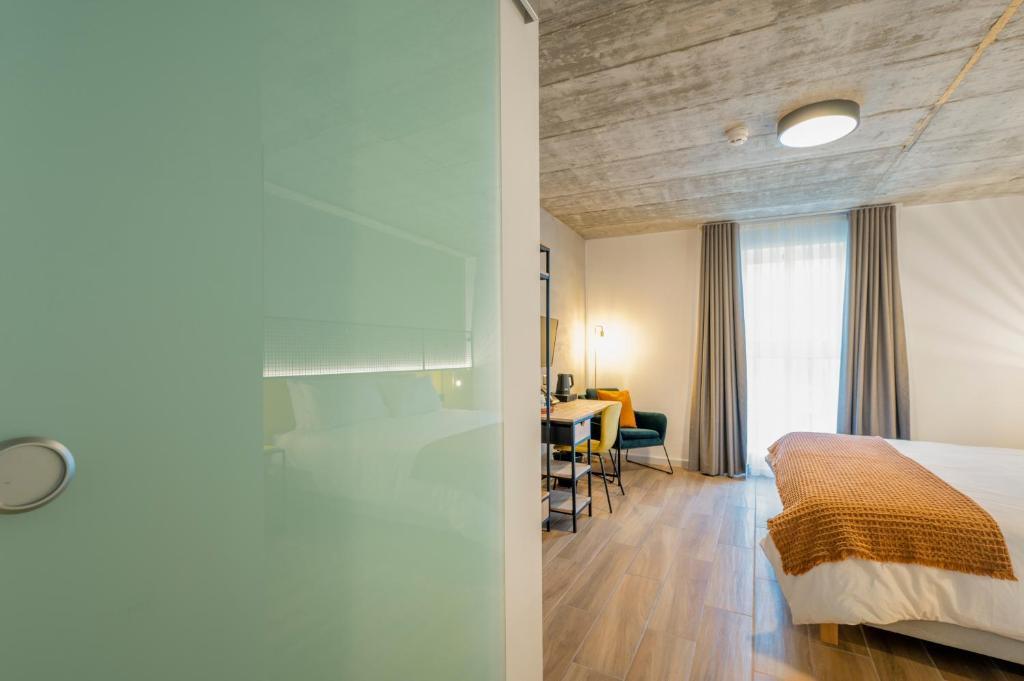 Postel nebo postele na pokoji v ubytování Fort40 Guest House