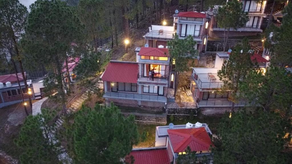an aerial view of a large house with red roofs at BluSalzz Escapade, Lansdowne - Uttarakhand in Lansdowne