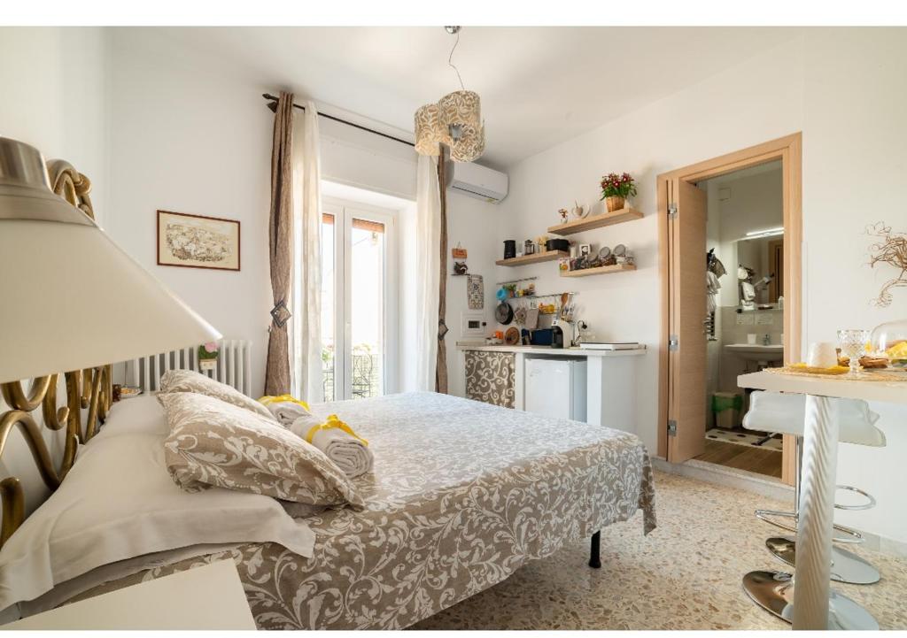 Posteľ alebo postele v izbe v ubytovaní Dany's House grazioso monolocale indip