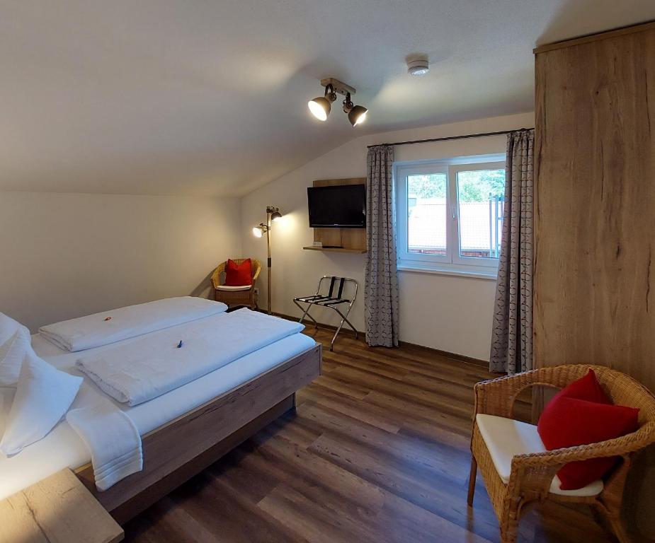 Postel nebo postele na pokoji v ubytování Hotel Garni Malerwinkl