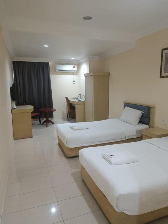 Postel nebo postele na pokoji v ubytování HOTEL AMBASSADOR 2