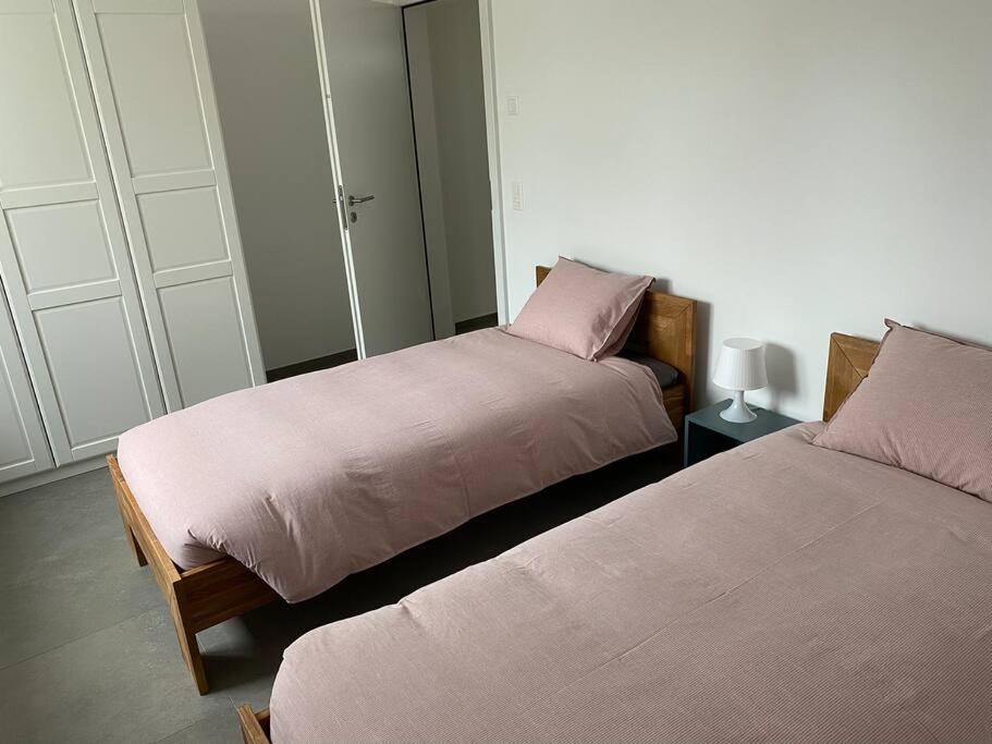 Postel nebo postele na pokoji v ubytování Appartamento 3.5 Camorino-Vigana