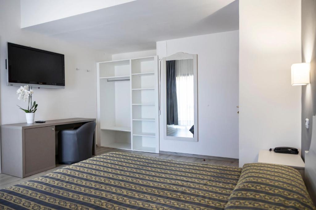 Postel nebo postele na pokoji v ubytování Hotel Villa Margherita