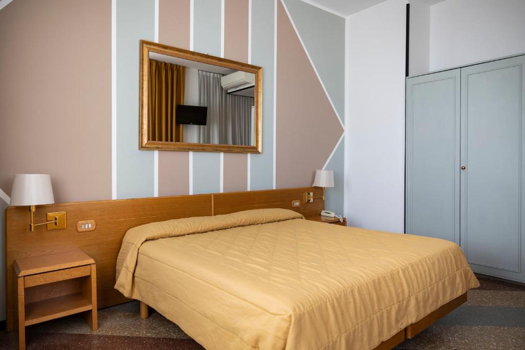 Postel nebo postele na pokoji v ubytování Hotel Villa Margherita