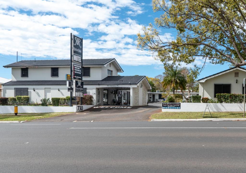 a house with a sign on the side of a street at Riviera on Ruthven in Toowoomba