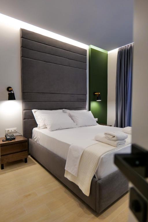Uma cama ou camas num quarto em NERIUM Hotel