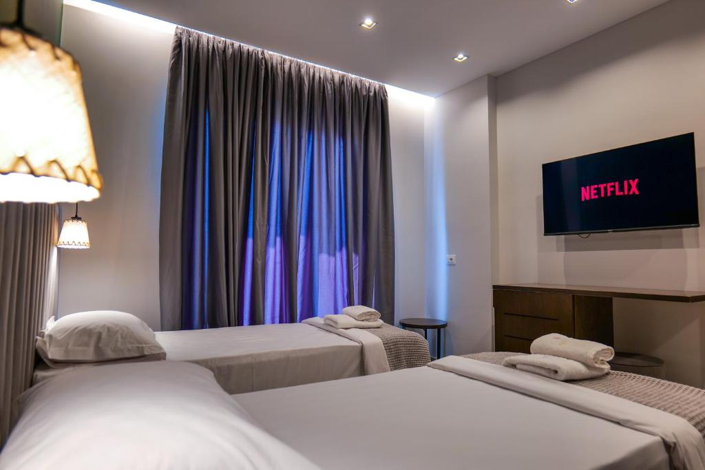 Uma cama ou camas num quarto em NERIUM Hotel