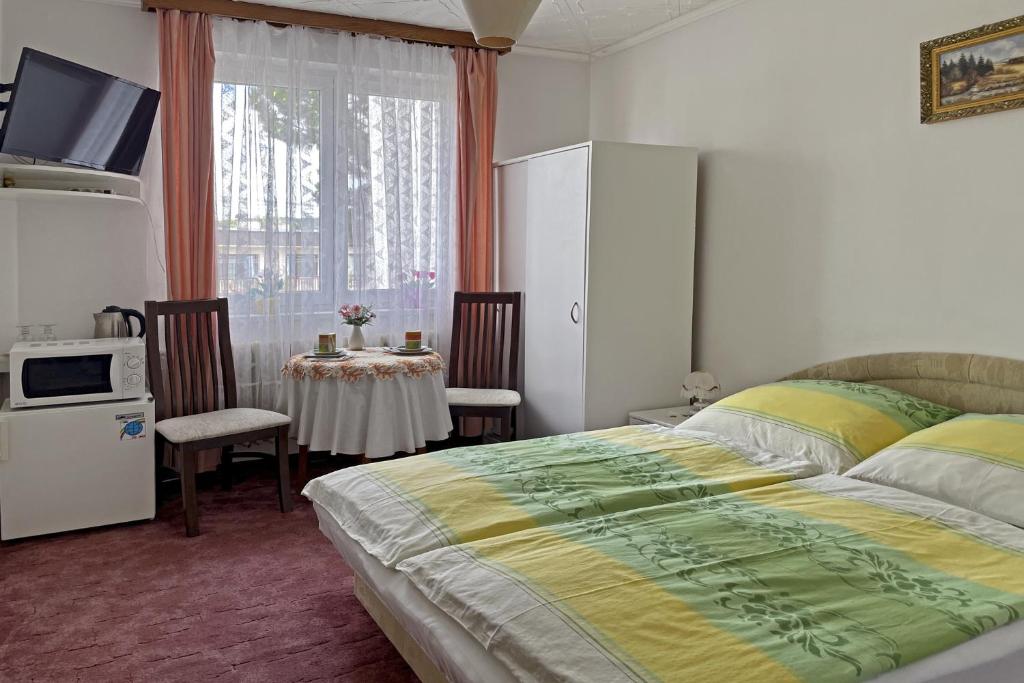 Postel nebo postele na pokoji v ubytování Pension Villa Hany