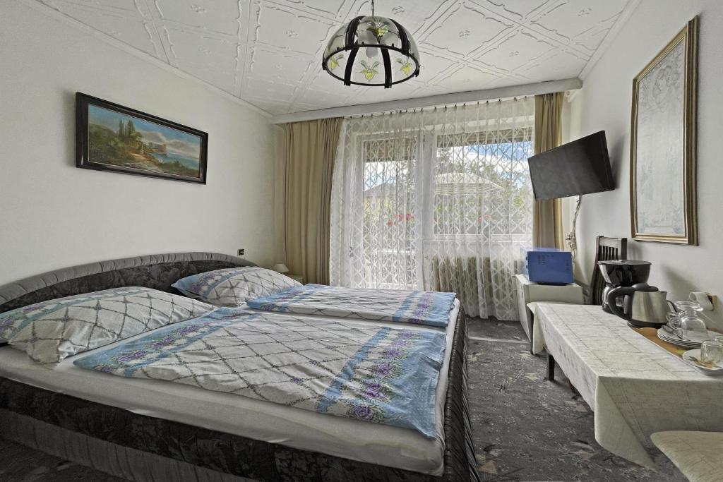 Postel nebo postele na pokoji v ubytování Pension Villa Hany