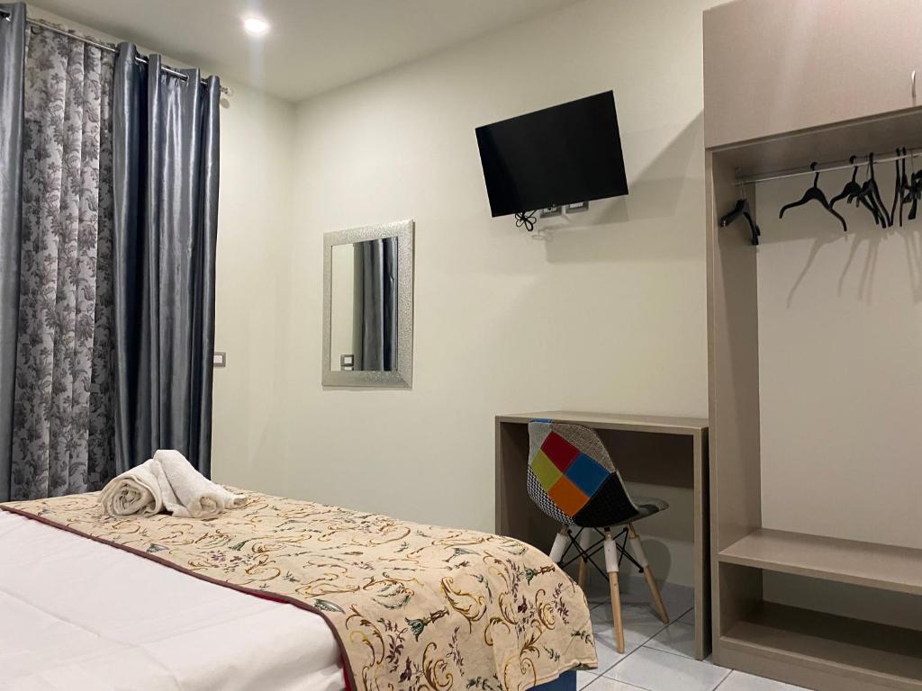 Posteľ alebo postele v izbe v ubytovaní Akoya Rooms Capo Vaticano