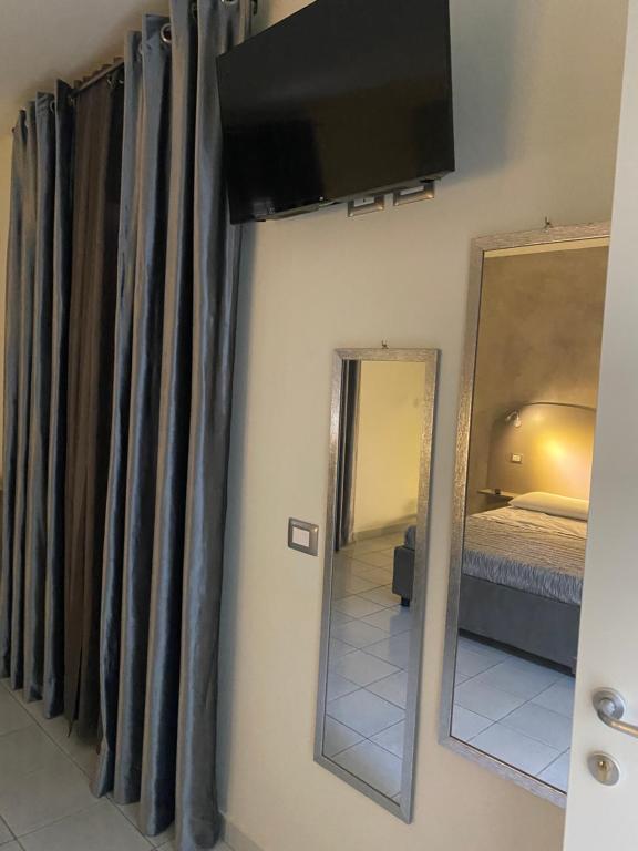 Posteľ alebo postele v izbe v ubytovaní Akoya Rooms Capo Vaticano