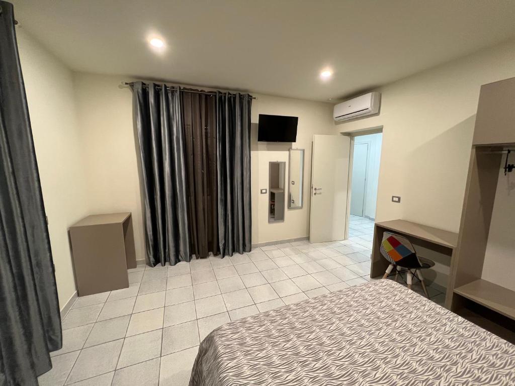 Posteľ alebo postele v izbe v ubytovaní Akoya Rooms Capo Vaticano