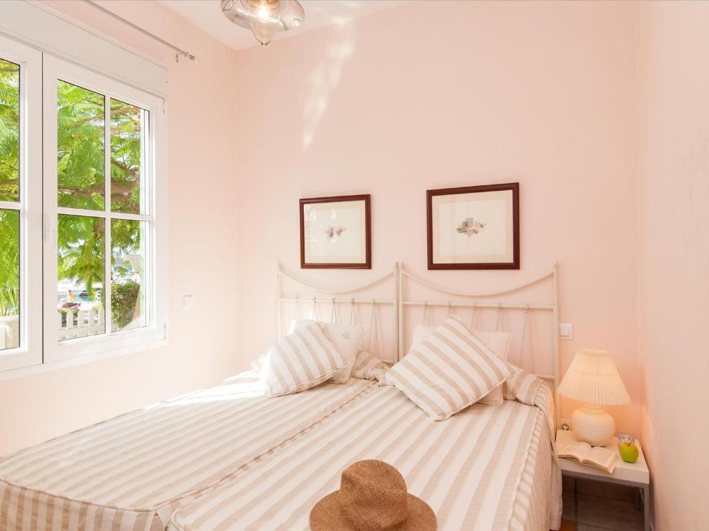 Postel nebo postele na pokoji v ubytování Bungalow Marina Deluxe