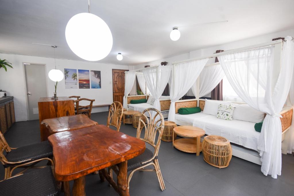 a living room with a couch and a table at 8 Colors Beach House Resort in Boracay