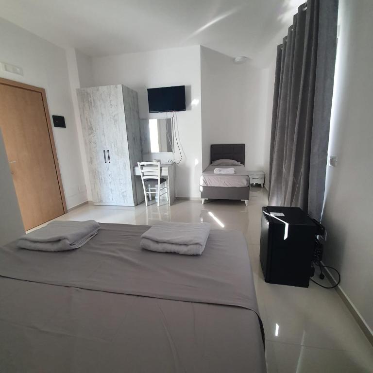 Postel nebo postele na pokoji v ubytování Hotel 33