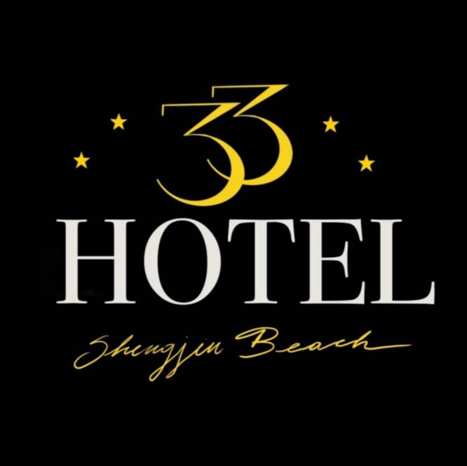 a gold hotel logo on a black background at Hotel 33 in Shëngjin