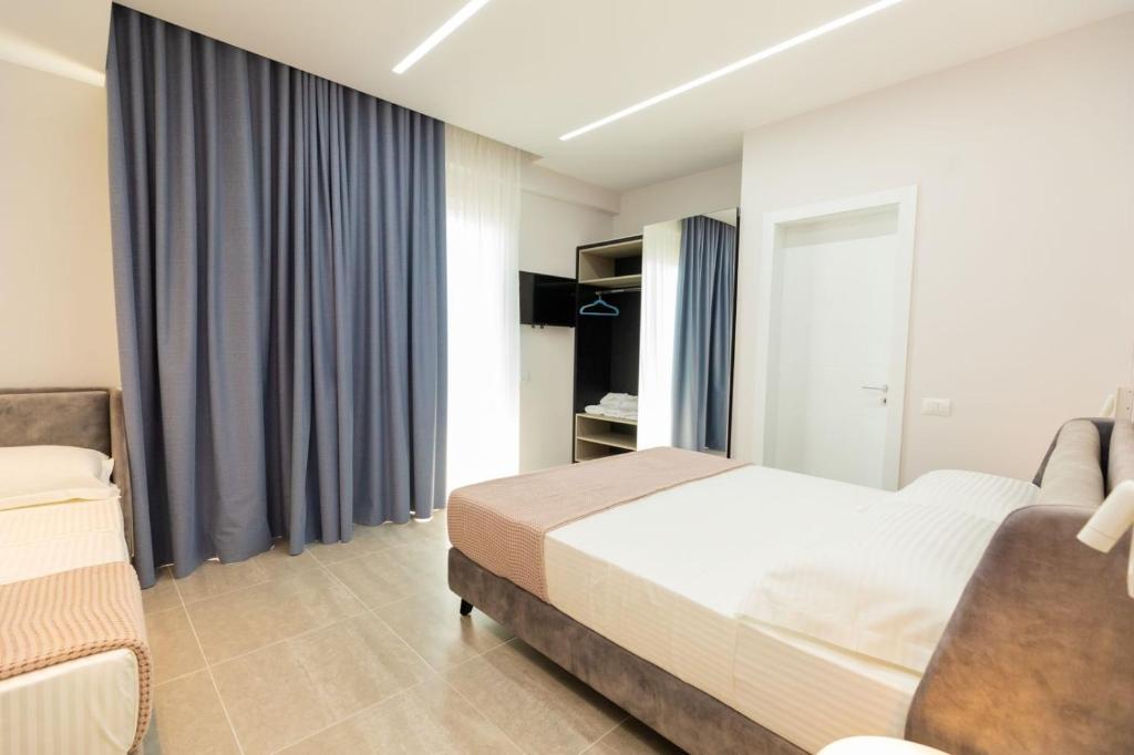 Postel nebo postele na pokoji v ubytování Corallo Rooms
