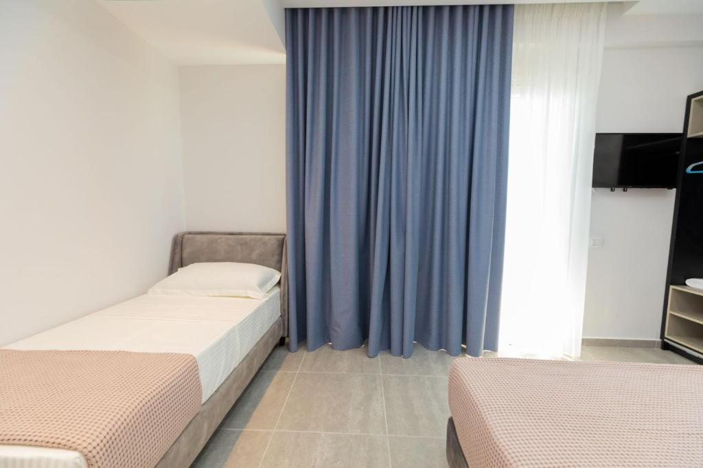 Postel nebo postele na pokoji v ubytování Corallo Rooms