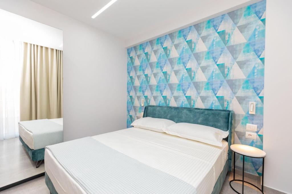 Postel nebo postele na pokoji v ubytování Corallo Rooms