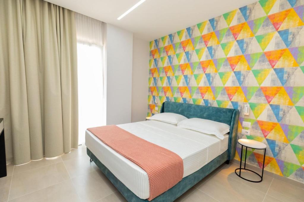 Postel nebo postele na pokoji v ubytování Corallo Rooms