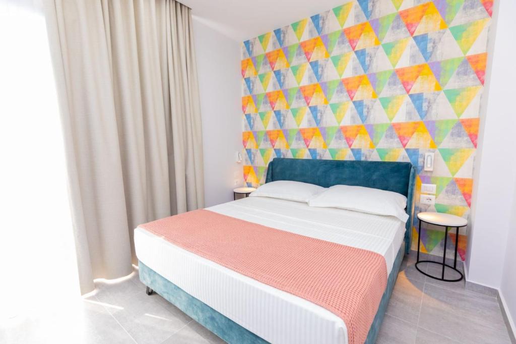 Postel nebo postele na pokoji v ubytování Corallo Rooms