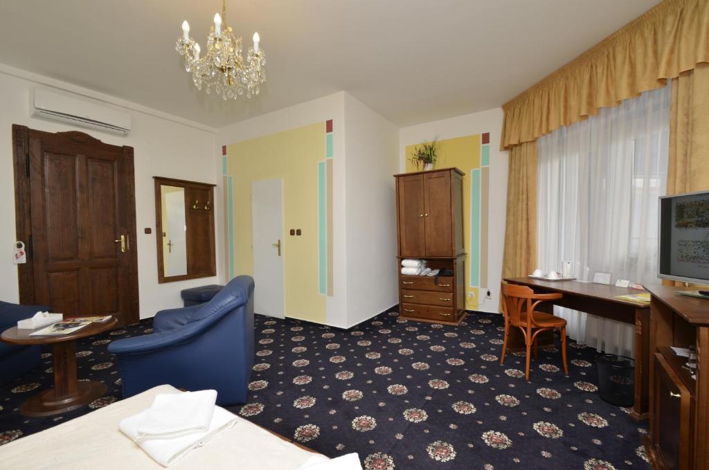 TV a/nebo společenská místnost v ubytování Brioni Suites