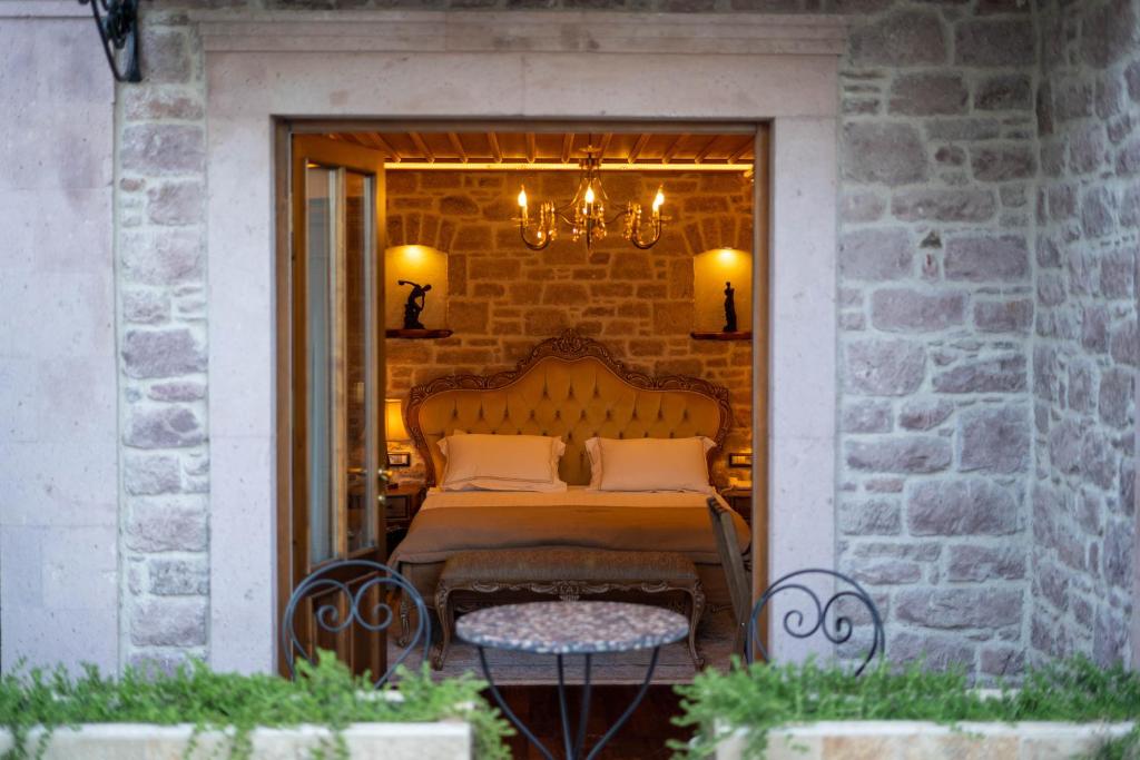A bed or beds in a room at CUNDA BARADİEL Hotel