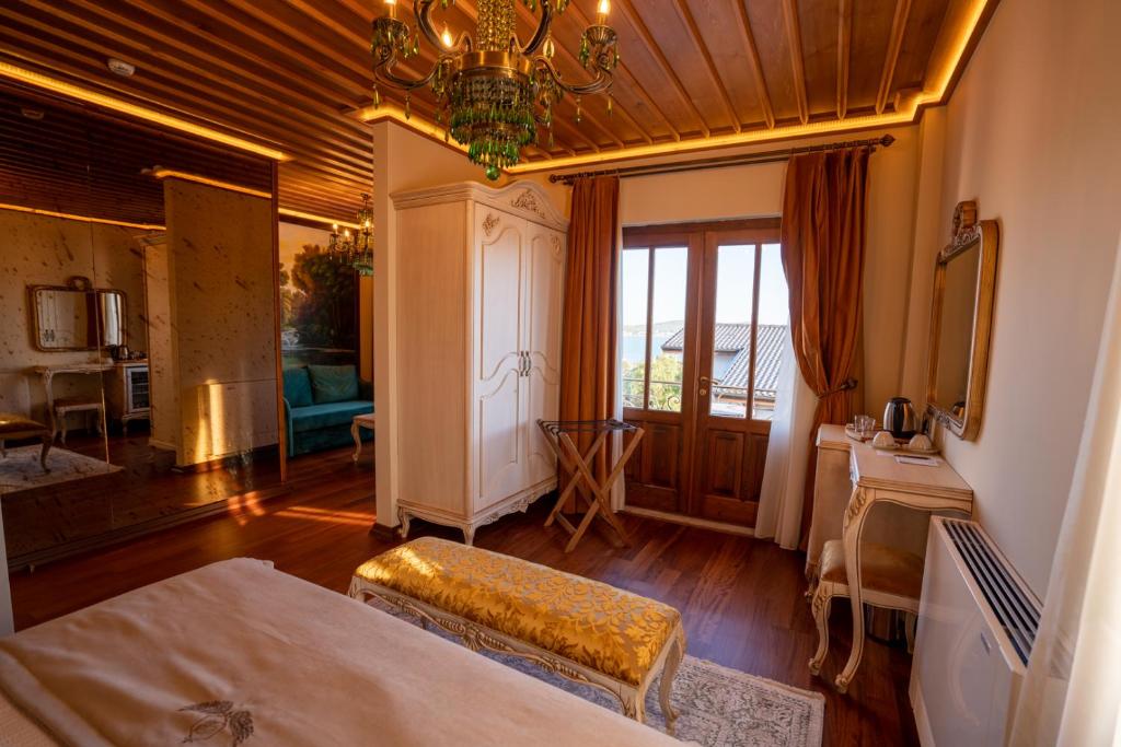 A bed or beds in a room at CUNDA BARADİEL Hotel