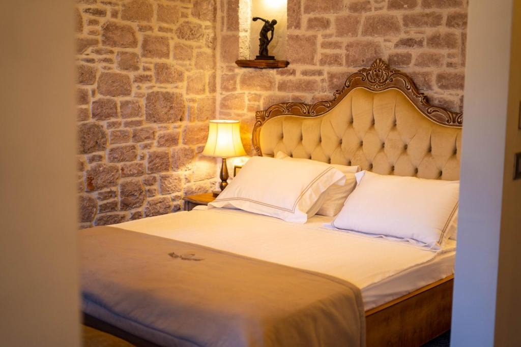 A bed or beds in a room at CUNDA BARADİEL Hotel