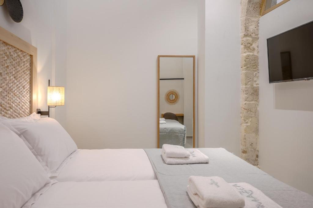 Posteľ alebo postele v izbe v ubytovaní Marea Boutique Suites