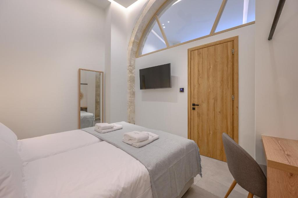 Posteľ alebo postele v izbe v ubytovaní Marea Boutique Suites
