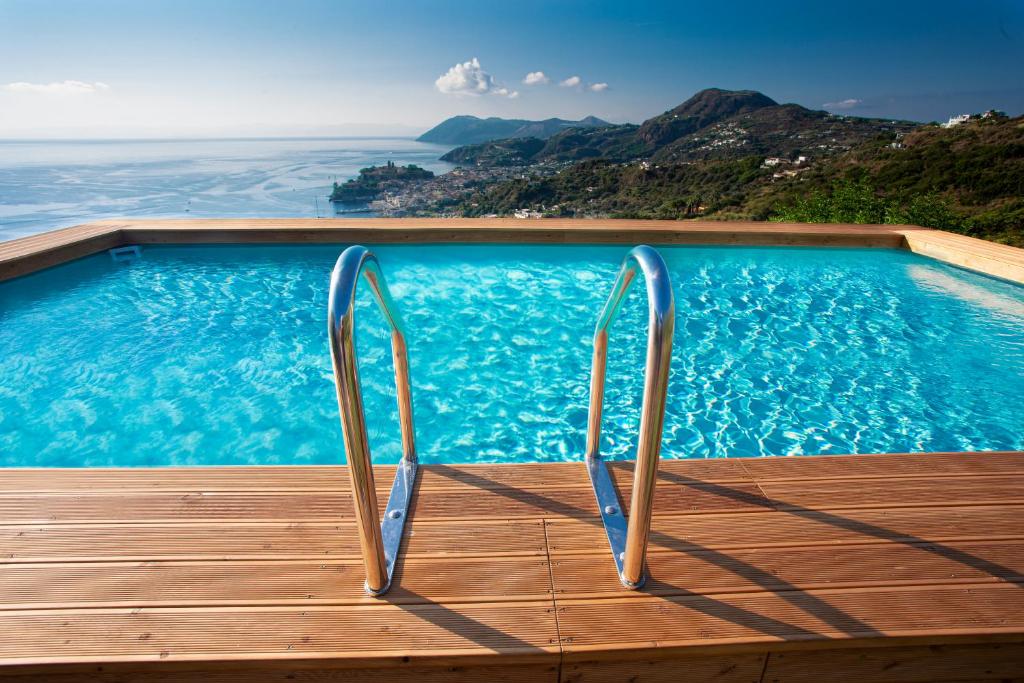 a swimming pool with a view of the ocean at Casa Nostra, stunning, elegant villa in Lipari with pool in Lipari