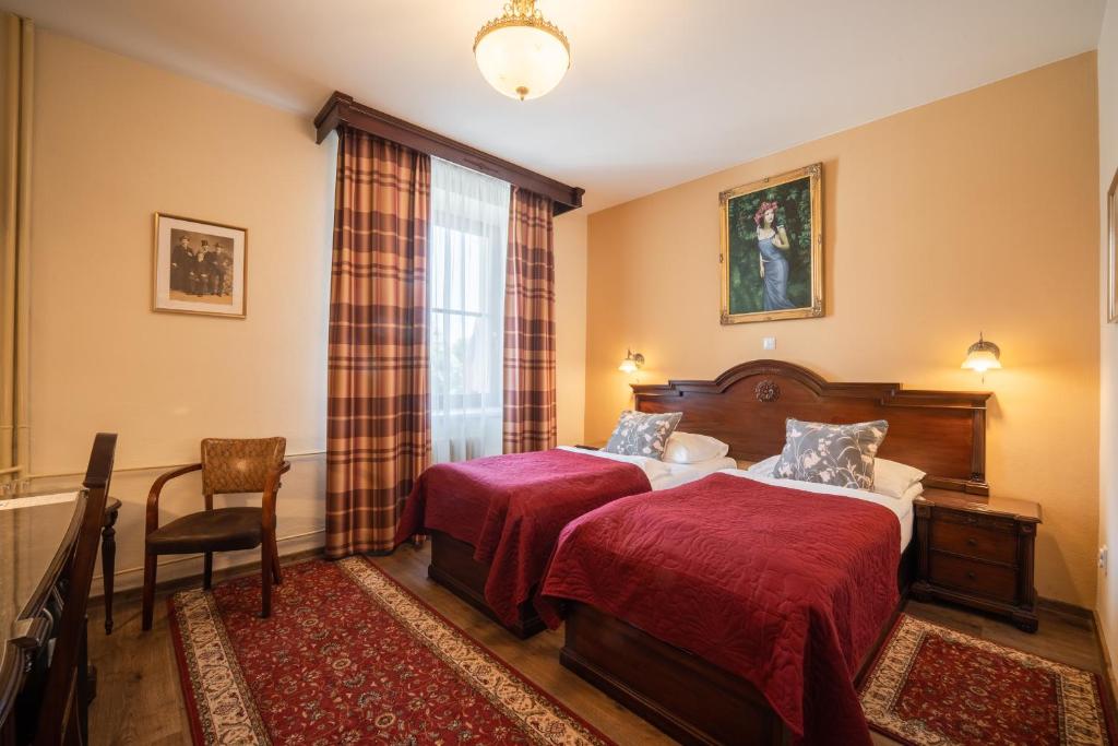 Postel nebo postele na pokoji v ubytování Hotel Grand
