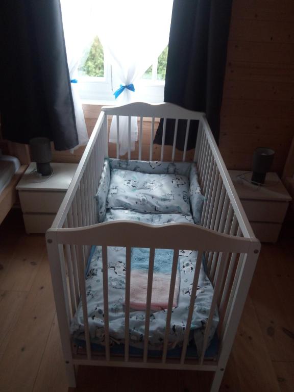 Postel nebo postele na pokoji v ubytování Domek letniskowy