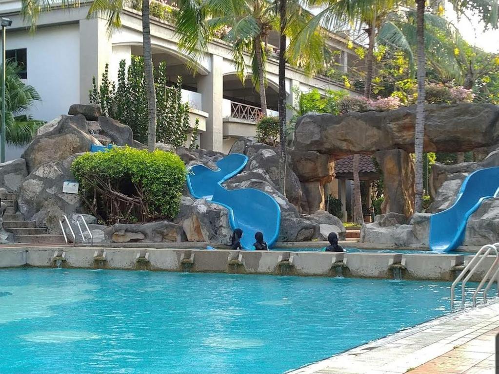 a pool at a resort with a water park at Century Mahkota Apartments in Melaka
