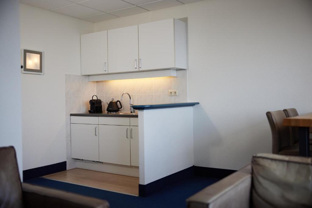Kuchyň nebo kuchyňský kout v ubytování WestCord Hotel Schylge