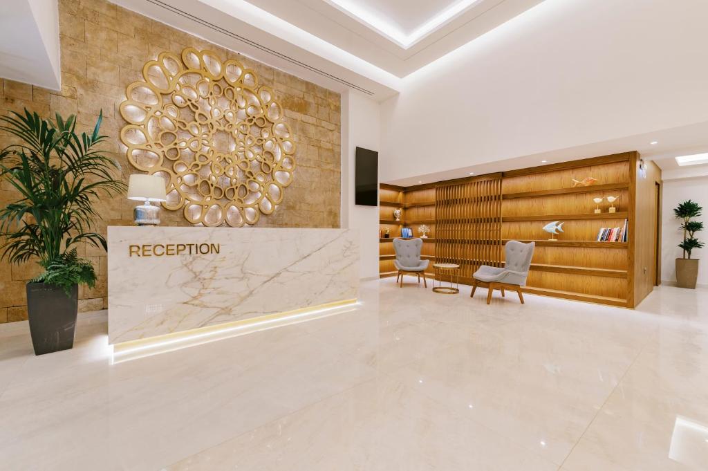 a lobby of a hotel with a reception desk at Acandia Hotel in Rhodes Town