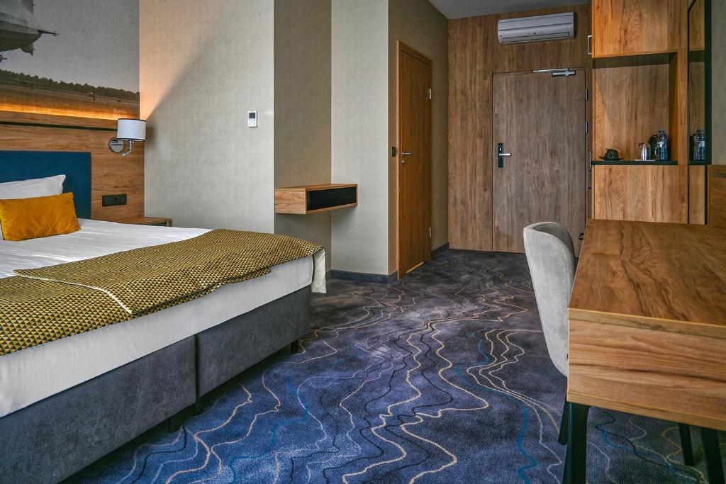 Postel nebo postele na pokoji v ubytování Sopotorium Hotel & Medical Spa
