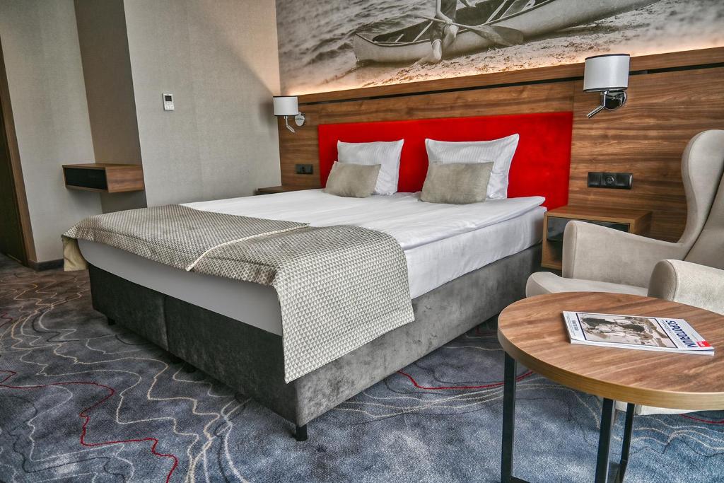 Postel nebo postele na pokoji v ubytování Sopotorium Hotel & Medical Spa